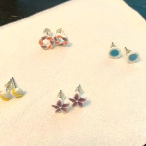 Four porcelain stud earrings